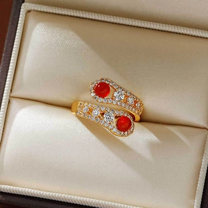 Elegant gold snake-shaped open ring with red agate stones and shiny zircon pavé