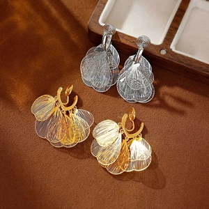 Golden and silver metal tassel clip-on earrings with layered filigree fan design