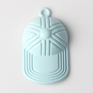 Close-up of light blue enamel baseball cap charm with top hanging loop for jewelry making