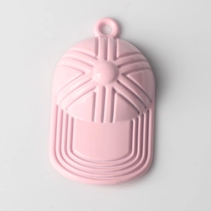 Close-up of pink baseball cap alloy charm with glossy finish and top hanging ring