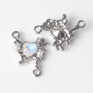 Detailed view of heart-shaped opal connector with pearls for DIY jewelry making