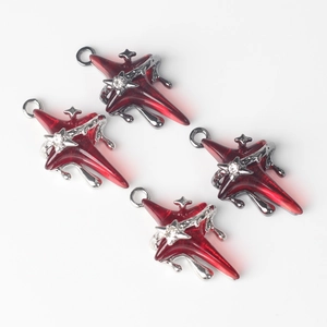 Detail of four red resin star pendants with crystal center and dark metal drip edge