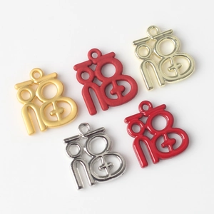 Five assorted alloy Fu pendants in matte and glossy finishes for DIY jewelry making