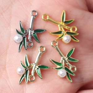 Bamboo leaf pendant with pearl and green enamel in gold and silver finish