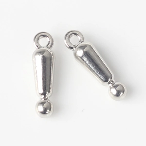 Close-up of polished silver exclamation mark charms for DIY jewelry making