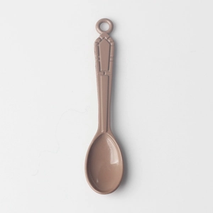 Detailed view of coffee-colored alloy spoon pendant with vintage embossed pattern and loop