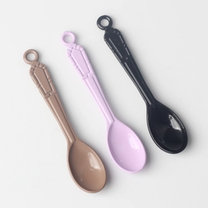 Mini alloy spoon pendants in brown, lavender, and black with vintage embossed textures