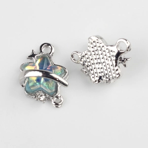 Macro detail of alloy star pendant with resin inlay and dual hooks for DIY jewelry