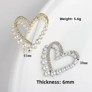 Alloy heart pendant with pearls and zircon crystals in gold and silver finish