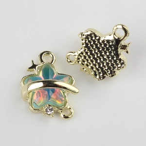 Detailed macro view of star-shaped resin alloy pendants with gold plating for jewelry DIY