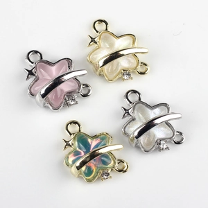 Detailed view of star-shaped resin connectors with alloy frames for DIY jewelry