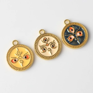 Three colorful alloy evil eye pendants with gold frames for DIY jewelry and necklaces