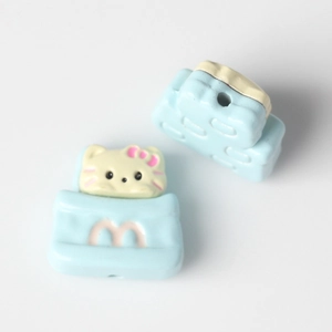 Detail of blue cat charm with side hole for DIY jewelry making and bracelets