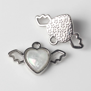 Front and back view of silver alloy heart wings pendant with pearlescent resin inlay