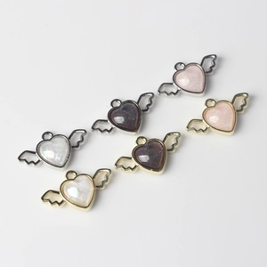 Alloy resin heart pendants with angel wings for DIY jewelry making in multiple colors
