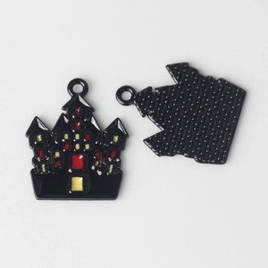 Macro shot of Halloween castle charms with black alloy finish and colorful oil drop details
