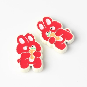 Close-up of red rabbit alloy pendants with oil drip finish for DIY jewelry crafting
