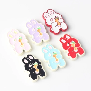 Detailed close-up of six colorful alloy rabbit charms with carrots for DIY jewelry making