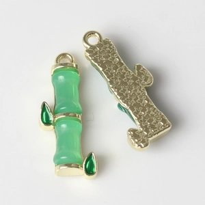 Detailed front and back view of golden bamboo pendants with green enamel for DIY jewelry