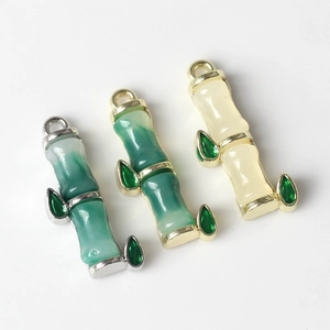 Detailed view of bamboo joint pendants with colorful resin inlay and hanging loops