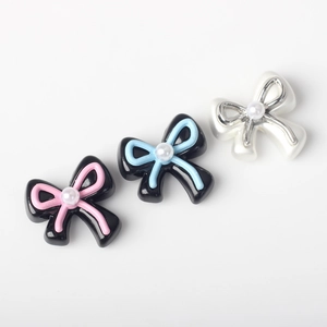 Three colorful bow charms with faux pearls for DIY jewelry making and handmade accessories