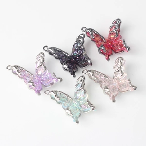 Set of five resin butterfly charms with silver metal frames for DIY jewelry making