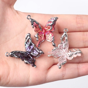 DIY alloy butterfly pendants with resin inlay in pink, purple, and transparent tones