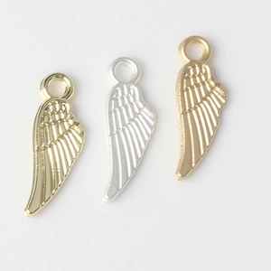Three minimalist alloy feather pendants in gold, silver, and rose gold for DIY jewelry making