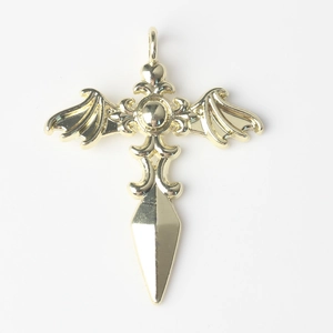 Macro view of golden gothic cross wing pendant with sword tip detail for DIY jewelry