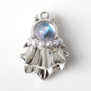 Detail of ghost charm with alloy finish, iridescent gemstone and faux pearl accents