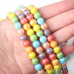 Macro detail of 8mm candy color iridescent glass beads with pearlescent glow for DIY jewelry