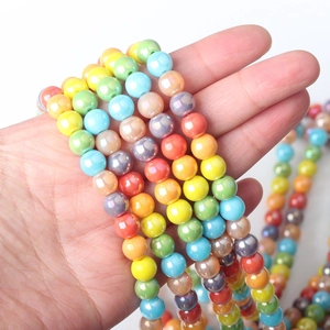 Macro view of 8mm iridescent rainbow glass beads for DIY jewelry making and crafts