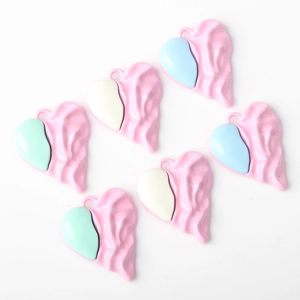 Pink heart-shaped pendants with lava texture and colorful accents for DIY jewelry
