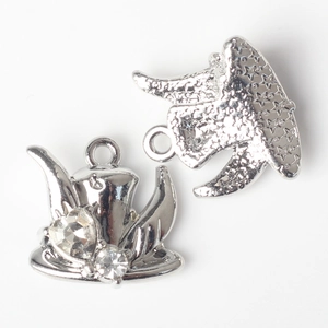 Macro detail of elephant pendant with crystal inlay and star pattern engraving