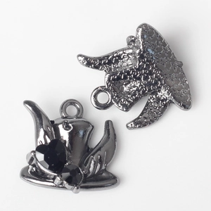 Detail of gothic witch hat pendant with black heart rhinestone and star textured back
