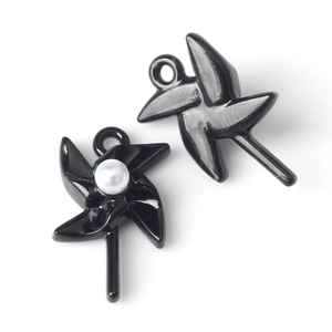 Detail showing black lacquer windmill pendant charms with pearl inlay for DIY jewelry