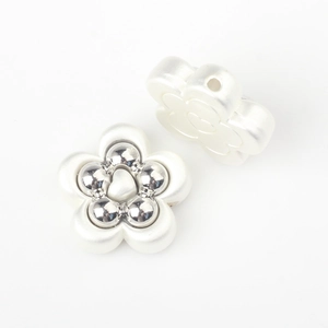 Detail of flower spacer beads with matte white petals and silver core for DIY jewelry