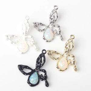 Minimalist liquid metal butterfly pendants with colorful resin opal stones in four colors