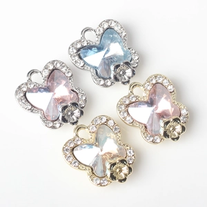 Detailed view of colorful butterfly pendants with sparkling crystals and rhinestones