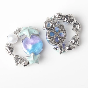 Detail of starfish pendant with blue-purple gradient resin and faux pearls