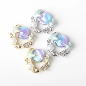 Starfish and seashell pendants with iridescent beads for DIY jewelry making