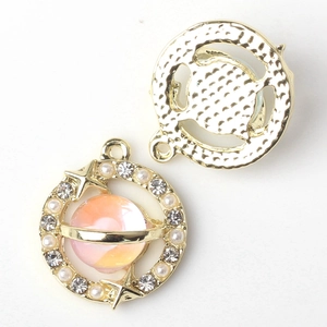Detailed front and back views of alloy planet pendant with pink enamel and crystals