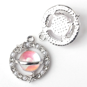 Front and back detail of alloy galaxy pendant with pink orb and sparkling crystals