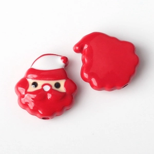 Detailed macro view of Santa Claus alloy charms showing front and back for DIY jewelry