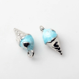 Detailed view of light blue enamel ice cream pendants with silver metal base for jewelry DIY