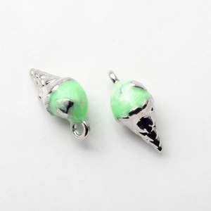 Macro detail of ice cream cone pendants with mint green enamel and silver zinc alloy