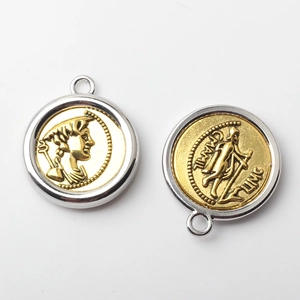 Macro view of vintage coin pendants with embossed figures and dual-tone metal plating