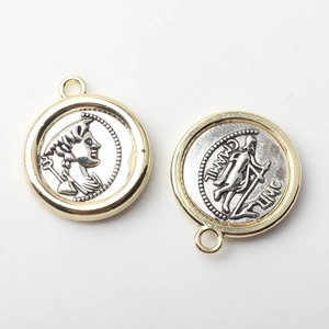 Detailed view of two-tone gold and silver coin pendants with relief portraits for DIY jewelry