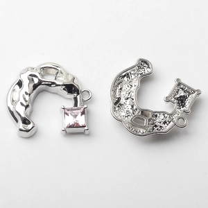 Front and back detail of C-shaped silver alloy pendants with pink square rhinestones