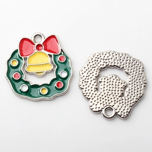 Detailed view of colorful enamel Christmas wreath and bell pendant for DIY jewelry crafts